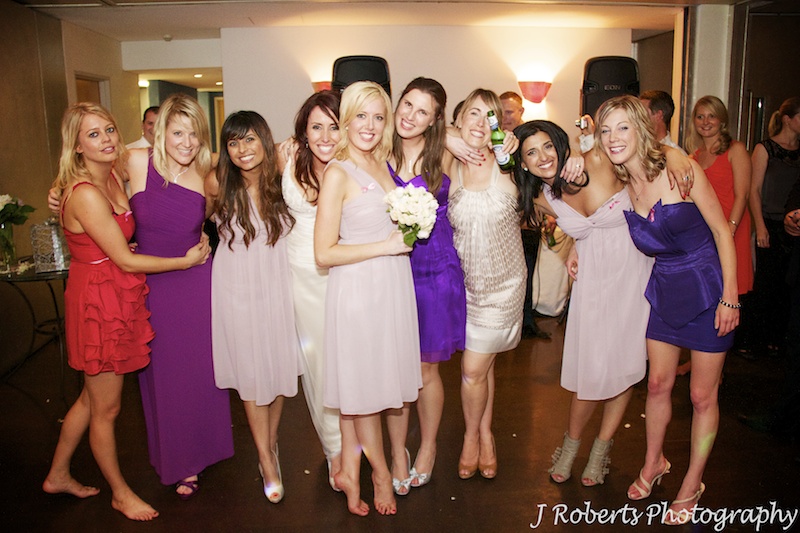 Bride with all the single girls after the bouquet throw - wedding photography sydney